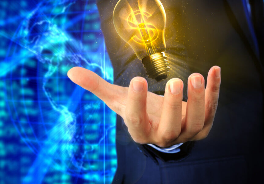 Closeup of a hand of an asian business man with a U.S. Dollar lightbulb